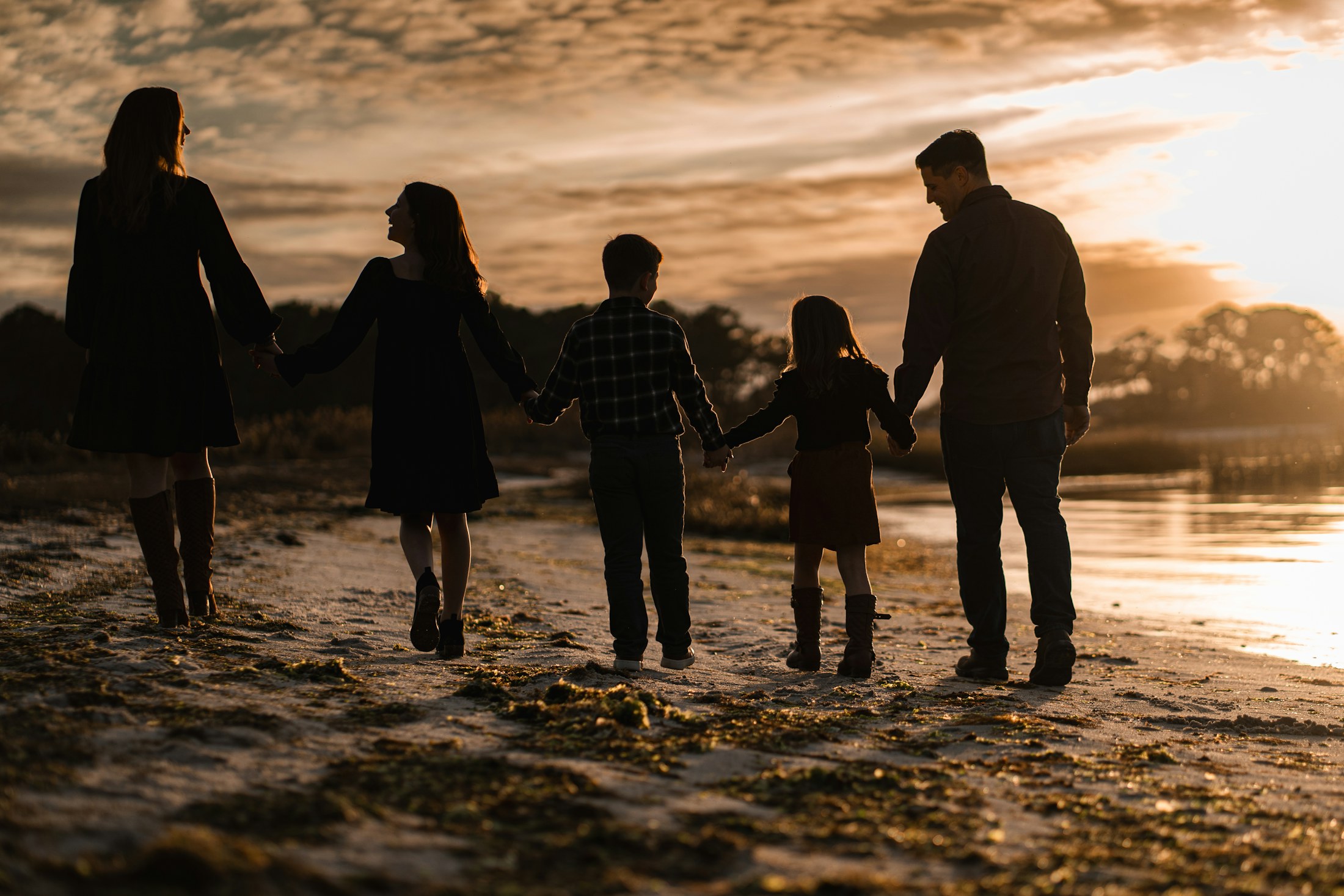 A family photograph presented in a natural oak frame